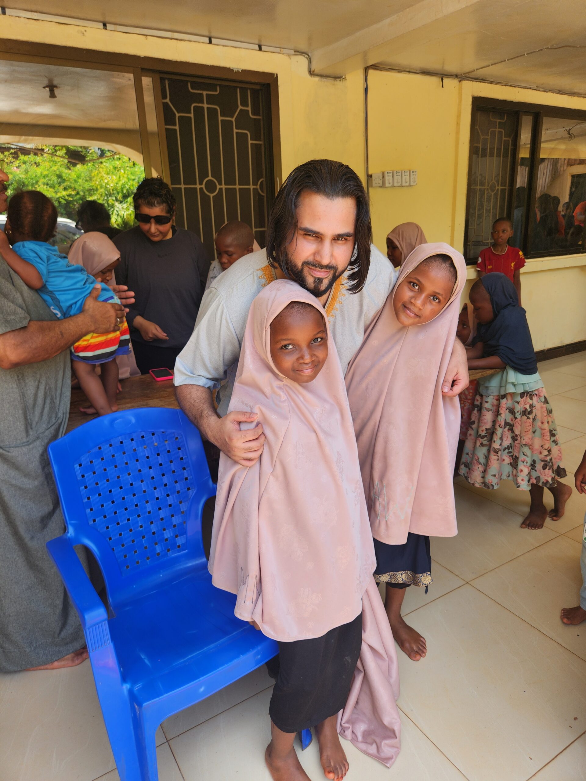 Kukua volunteers with children